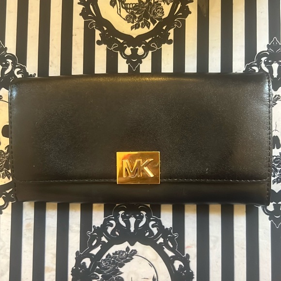 Michael Kors Handbags - Michael Kors black clutch wallet